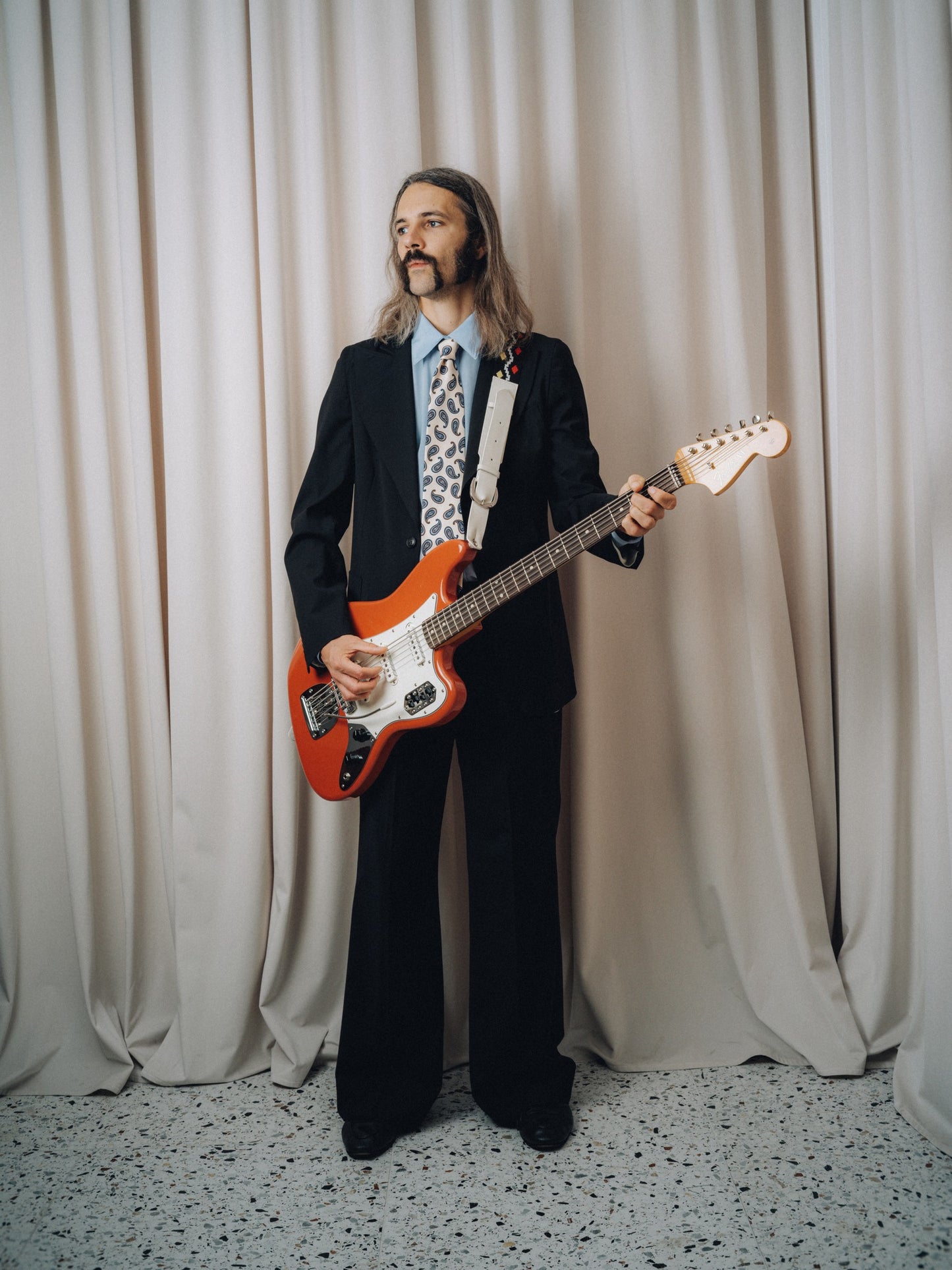 Dancing Balera Jacket in black with a red electric guitar, front view on model