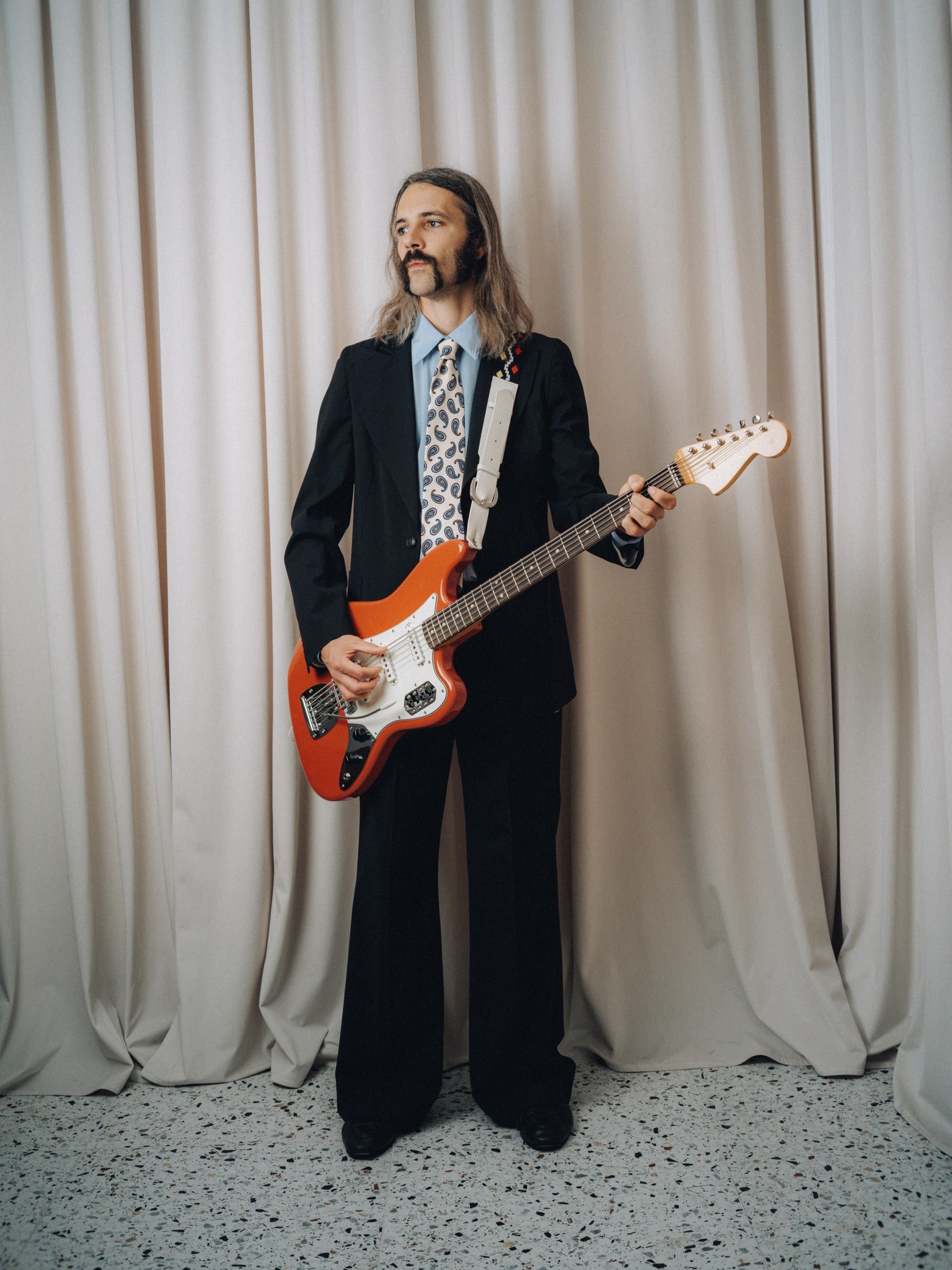 Dancing Balera Jacket in black with a red electric guitar, front view on model