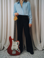 Dancing Balera Trousers in black, high-rise flare with a light blue shirt and red electric guitar