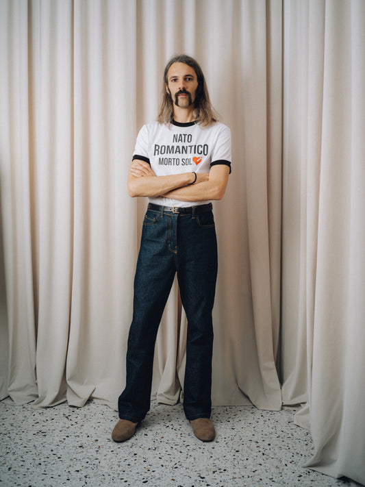 Romantico T-shirt in white ringer style with dark indigo jeans, full figure